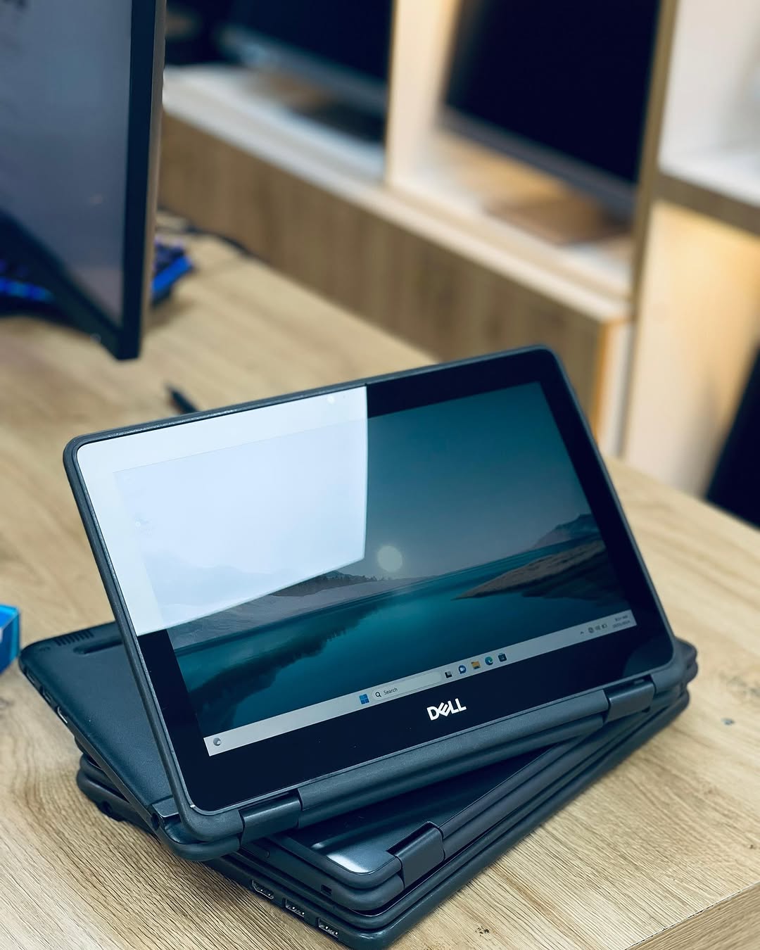 Dell Latitude 3190 held showing back cover