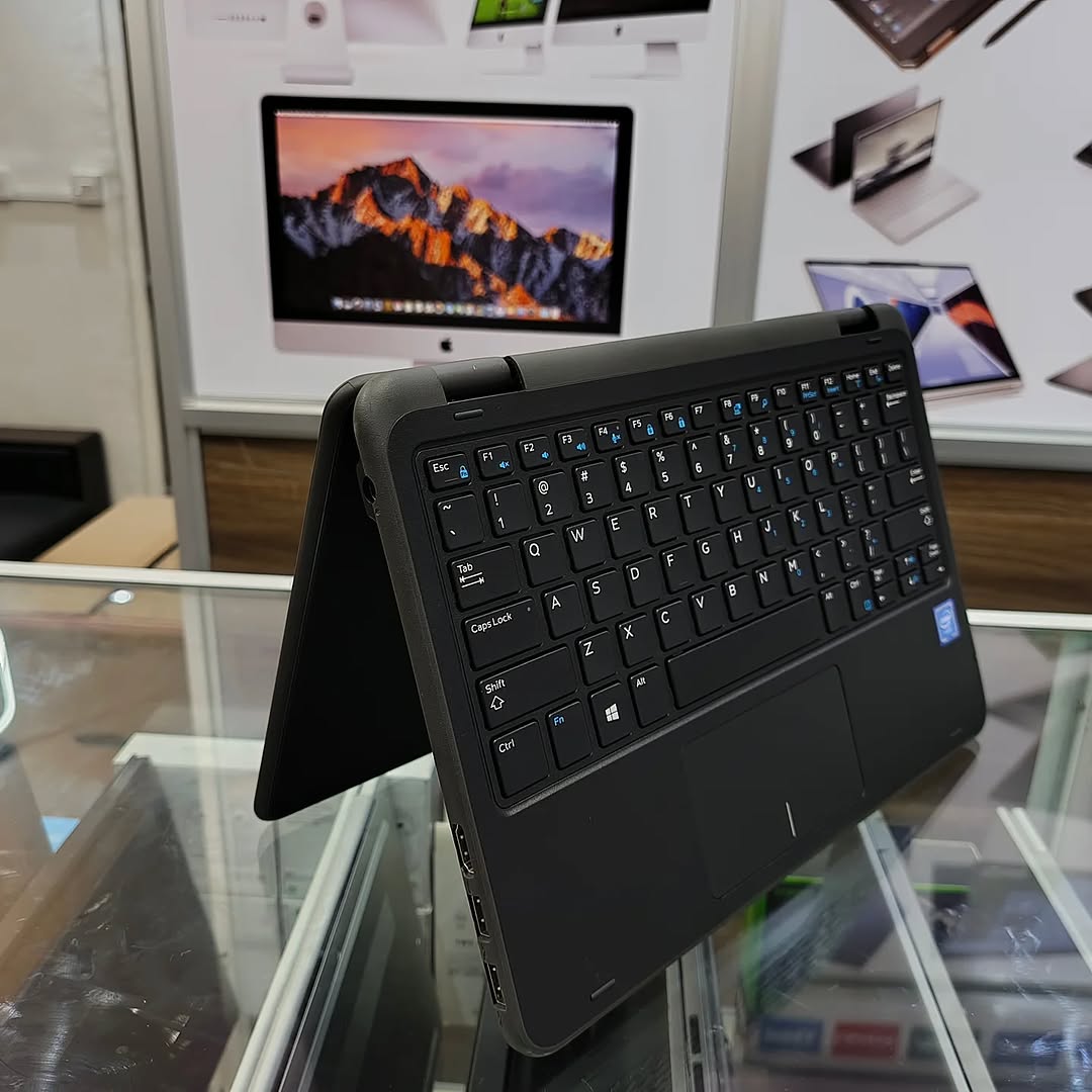 Multiple Dell Latitude 3190 laptops on table